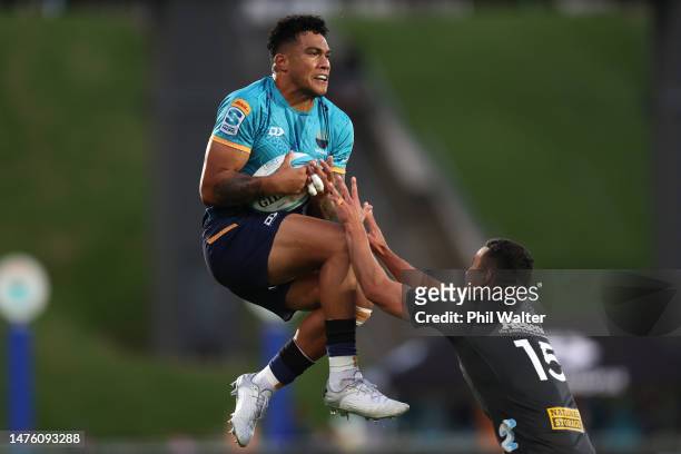 Tima Fainga'anuku of Moana Pasifika is tackled by Josh Moorby of the Hurricanes during the round five Super Rugby Pacific match between Moana...