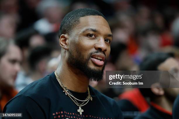 Damian Lillard of the Portland Trail Blazers watches from the bench during the second half against the Chicago Bulls at Moda Center on March 24, 2023...