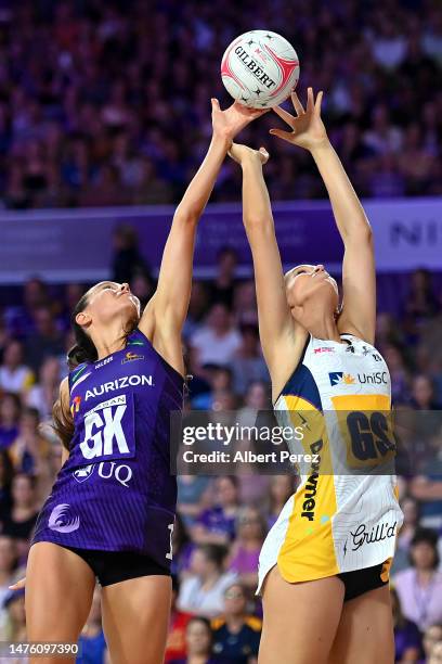 Ruby Bakewell-Doran of the Firebirds and Charlie Bell of the Lightning compete for the ball during the round two Super Netball match between the...