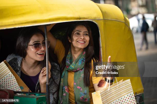 two happy women looking at view from rickshaw - rickshaw stock pictures, royalty-free photos & images