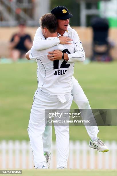 Teague Wyllie of Western Australia celebrates with the team after taking a catch to get a wicket during the Sheffield Shield Final match between...