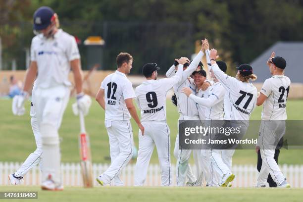 Teague Wyllie of Western Australia celebrates with the team after taking a catch to get a wicket during the Sheffield Shield Final match between...