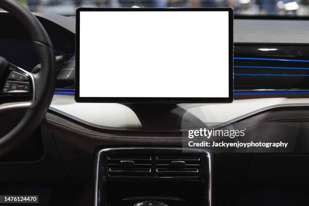 a digital display screen on the dashboard of a modern car - cuadro de instrumentos fotografías e imágenes de stock