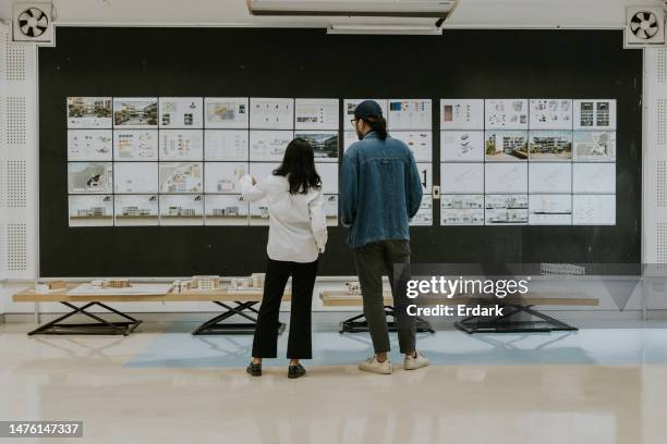 asian architects partner, consult and discuss about exhibition of architecture student's thesis work for sustainable design subject - moodboard stock pictures, royalty-free photos & images