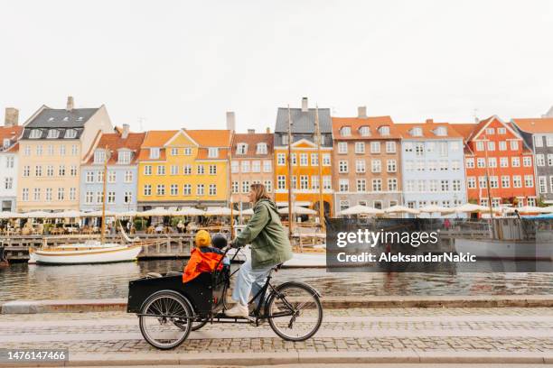 cargo bike ride with mom - danish culture stock pictures, royalty-free photos & images