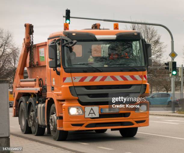 skip truck or freight transportation - garbage truck driving stock pictures, royalty-free photos & images