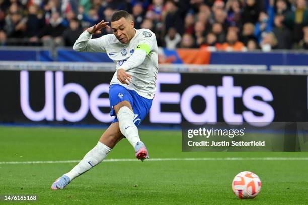 Kylian Mbappe of France scores the team's third goal during the UEFA EURO 2024 qualifying round group B match between France and Netherlands at Stade...