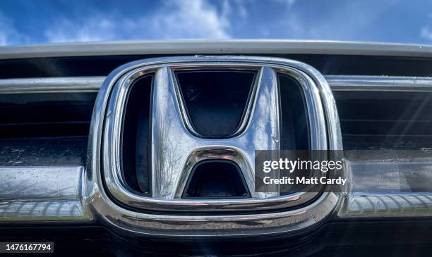Raindrops gather on the logo of the Honda Motor Company on the front grille of a Honda car in Exeter on March 25, 2023 in Devon, England. Honda - a...