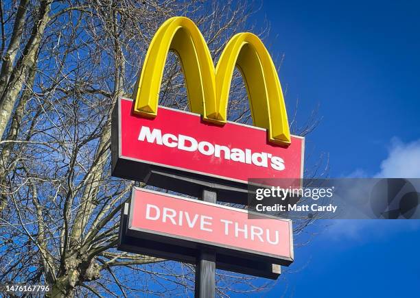 The sun shines on the Golden Arches and Drive Thru logo of the fast food restaurant McDonald's, on March 25, 2023 in Bristol, England. Founded in...