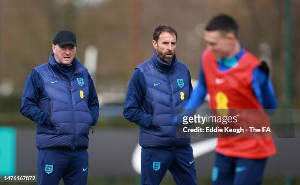 Gareth Southgate, Head Coach of England and Steve Holland, Assistant Coach of England look on during England Training Session & Press Conference at...