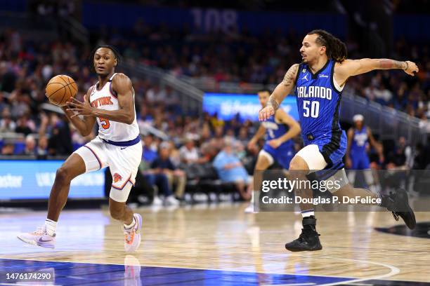 Immanuel Quickley of the New York Knicks dribbles the ball against the Orlando Magic during the first quarter at Amway Center on March 23, 2023 in...