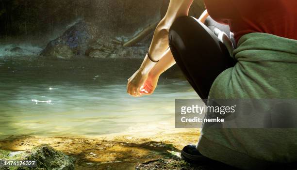 hiker woman refreshing herself in forest river - running water stream stock pictures, royalty-free photos & images