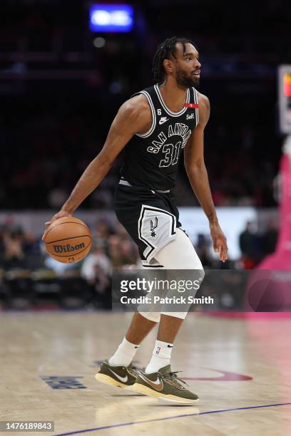 Keita Bates-Diop of the San Antonio Spurs dribbles against the Washington Wizards during the first half at Capital One Arena on March 24, 2023 in...