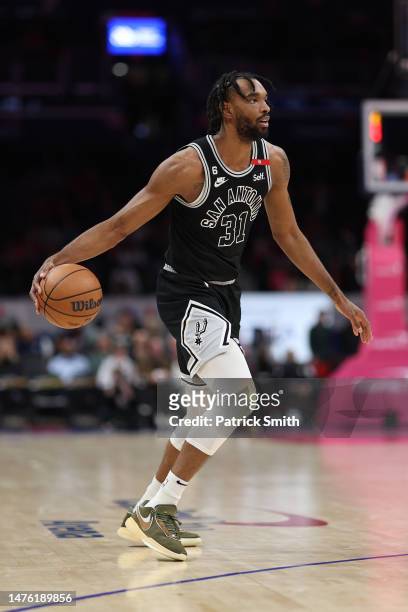 Keita Bates-Diop of the San Antonio Spurs dribbles against the Washington Wizards during the first half at Capital One Arena on March 24, 2023 in...
