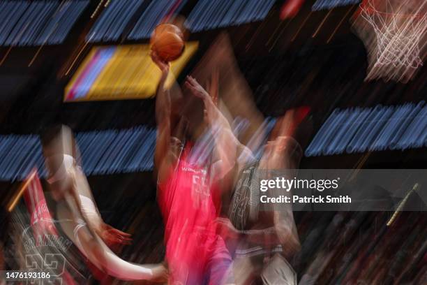 Delon Wright of the Washington Wizards shoots in front of Sandro Mamukelashvili of the San Antonio Spurs during the second half at Capital One Arena...