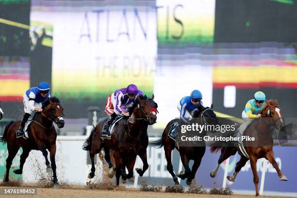 Christophe Lemaire riding Derma Sotogake, right, wins the UAE Derby during the Dubai World Cup at Meydan Racecourse on March 25, 2023 in Dubai,...