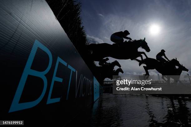 General view as runners clear the water jump during The Run For Your Money At BetVictor Handicap Chase at Newbury Racecourse on March 25, 2023 in...