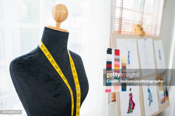 close-up of retro female tailor's mannequin torso with measuring tape - clothing design studio stock pictures, royalty-free photos & images