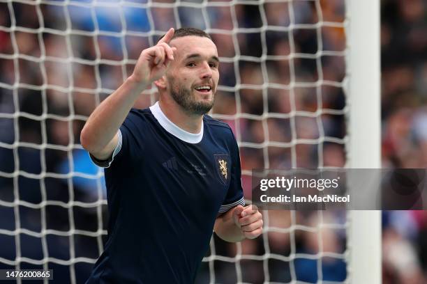 John McGinn of Scotland celebrates after scoring the team's first goal during the UEFA EURO 2024 Qualifying Round Group A match between Scotland and...