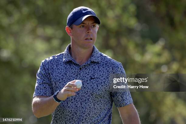 Rory McIlroy of Northern Ireland reacts after making birdie on the seventh green to win the hole against Lucas Herbert of Australia during day four...