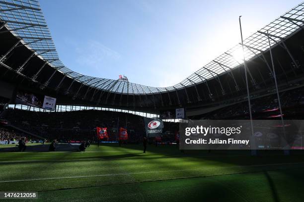 Flag bearers of Saracens wave flags as the players enter the field prior to the Gallagher Premiership Rugby match between Saracens and Harlequins at...