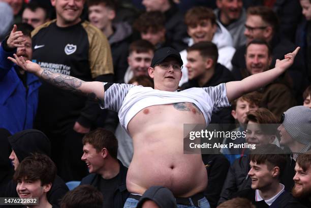 Supporter lifts up his shirt during the Sky Bet League One between Portsmouth and Port Vale at Fratton Park on March 25, 2023 in Portsmouth, England.