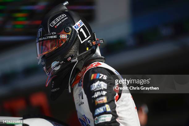 Kevin Harvick, driver of the Mobil 1 Ford, enters his car in the garage area during qualifying for the NASCAR Cup Series EchoPark Automotive Grand...