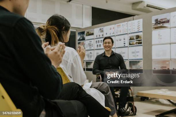 disability professor of architecture tells his students some good news. - succession planning stock pictures, royalty-free photos & images