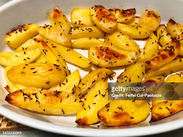 close-up of roast potatoes with cumin - cumin stock-fotos und bilder