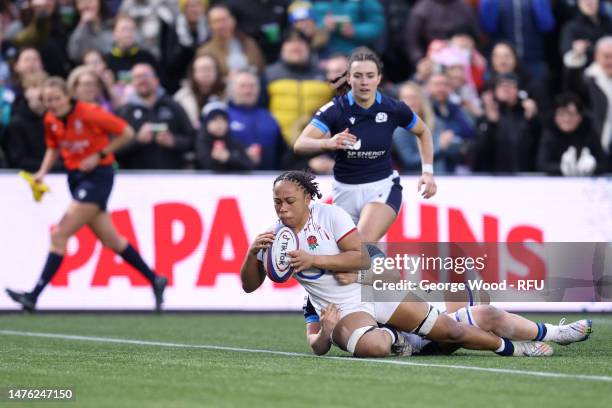 Sadia Kabeya of England scores the side's seventh try under pressure from Evie Gallagher of Scotland during the TikTok Women's Six Nations match...