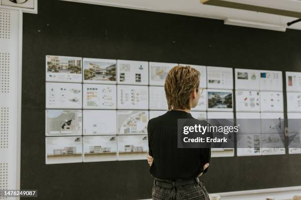 student's work exhibition, asian architect professor is commenting and suggesting his student final's work. - green building design stock pictures, royalty-free photos & images