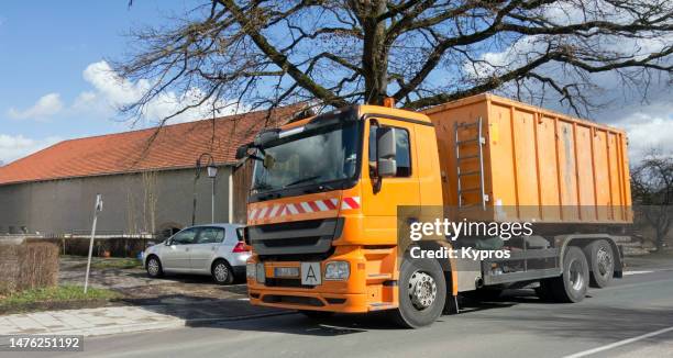 industrial waste removal truck or tipper - garbage truck driving stock pictures, royalty-free photos & images