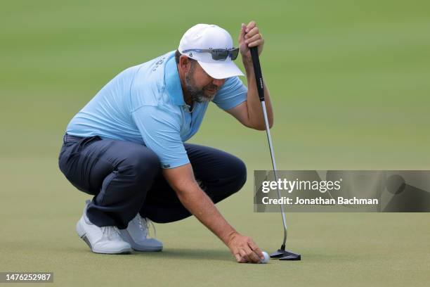 Erik Compton of the United States lines up a putt on the first green during the third round of the Corales Puntacana Championship at Puntacana Resort...