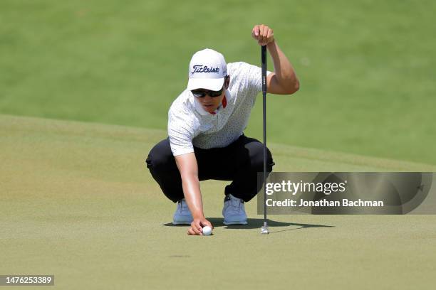 Michael Kim of the United States lines up a putt on the first green during the third round of the Corales Puntacana Championship at Puntacana Resort...