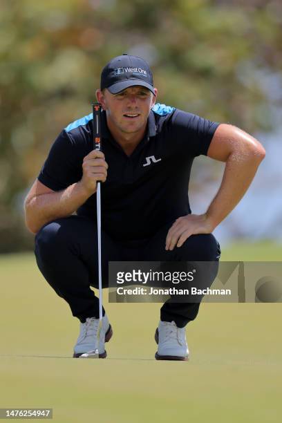 Matt Wallace of England lines up a putt on the first green during the third round of the Corales Puntacana Championship at Puntacana Resort & Club,...