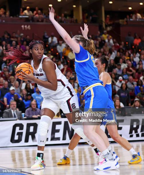 Aliyah Boston of the South Carolina Gamecocks handles the ball against Lina Sontag of the UCLA Bruins during the first half in the Sweet 16 round of...
