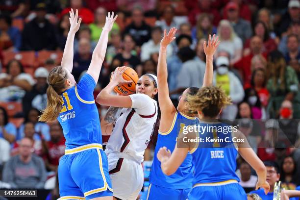 Kamilla Cardoso of the South Carolina Gamecocks handles the ball the against Gina Conti of the UCLA Bruins and Lina Sontag of the UCLA Bruins \d1 in...