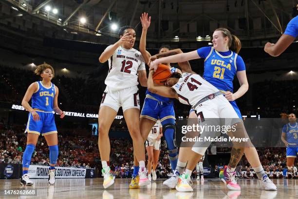 Kierra Fletcher of the South Carolina Gamecocks goes for a rebound against Lina Sontag of the UCLA Bruins during the first half in the Sweet 16 round...