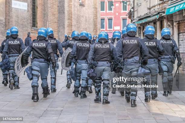 Policemen quickly approach the anarchists in Campo dei Frari on March 25, 2023 in Venice, Italy. The anarchists are protesting in support of Alfredo...