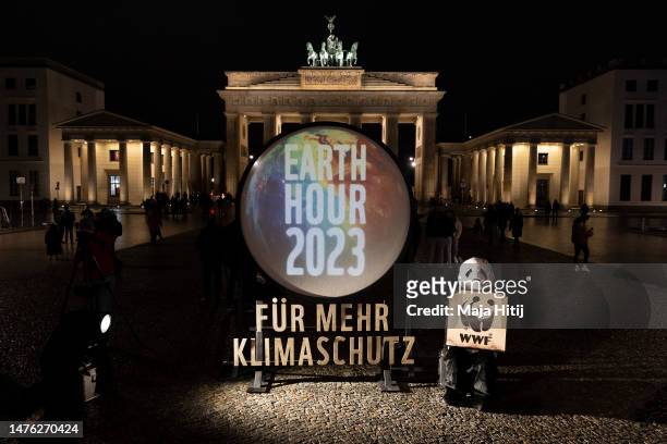 Protest of WWF prior the Earth Hour 2023 on March 25, 2023 in Berlin, Germany. Earth Hour is an annual event organized by the World Wildlife Fund in...