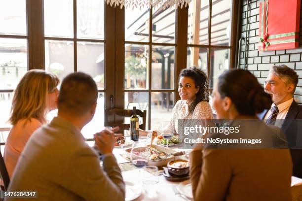 colleagues enjoying a business lunch - teambuilding stockfoto's en -beelden