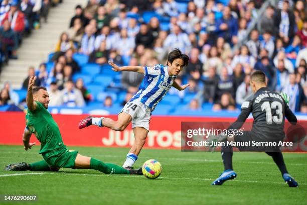 Takefusa Kubo of Real Sociedad scores the team's first goal during the LaLiga Santander match between Real Sociedad and Elche CF at Reale Arena on...