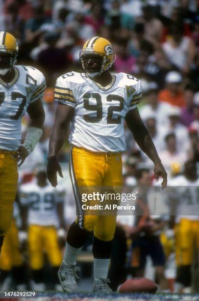 Defensive End Reggie White of the Green Bay Packers follows the action in the Pro Football Hall Of Fame Game between the Green Bay Packers vs the Los...