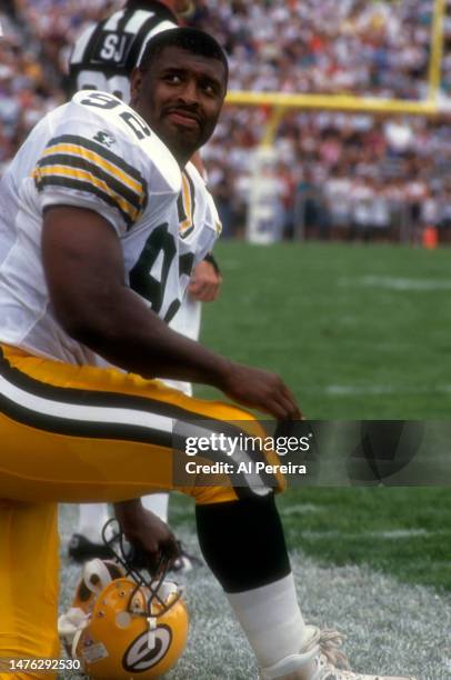 Defensive End Reggie White of the Green Bay Packers follows the action in the Pro Football Hall Of Fame Game between the Green Bay Packers vs the Los...