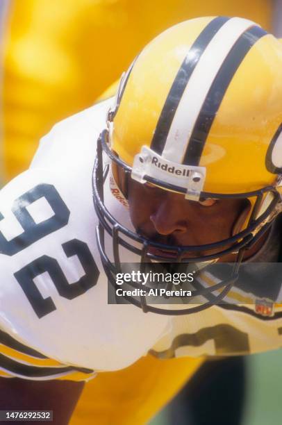 Defensive End Reggie White of the Green Bay Packers is set to rush the quarterback in the Pro Football Hall Of Fame Game between the Green Bay...