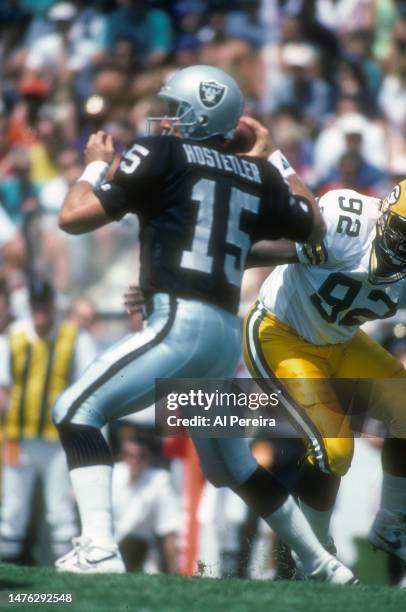 Defensive End Reggie White of the Green Bay Packers rushes the quarterback in the Pro Football Hall Of Fame Game between the Green Bay Packers vs the...