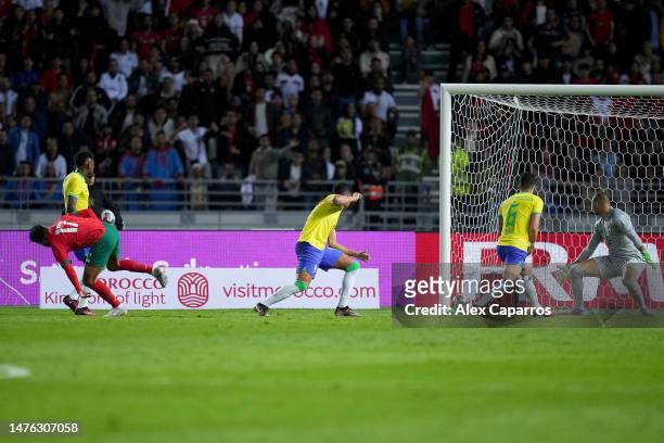 Sofiane Boufal of Morocco shoots for score their first side goal during the international friendly match between Morocco and Brazil at Grand Stade de...