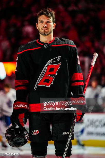 Brett Pesce of the Carolina Hurricanes stands on the ice before a game against the Toronto Maple Leafs at PNC Arena on March 25, 2023 in Raleigh,...