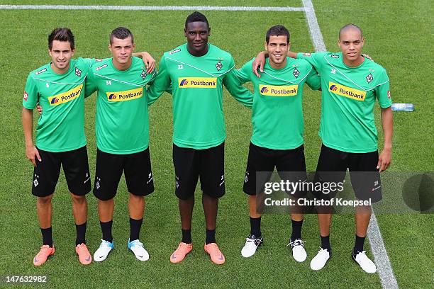 New players Lukas Rupp, Xahka, Peniel Mlapa, Alvaro Dominguez and Anderson pose during the training session of Borussia Moenchengladbach the club's...