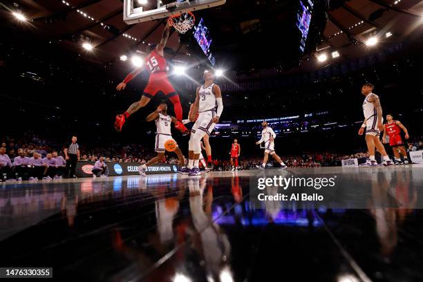 Alijah Martin of the Florida Atlantic Owls dunks the ball against David N'Guessan of the Kansas State Wildcats during the first half in the Elite...